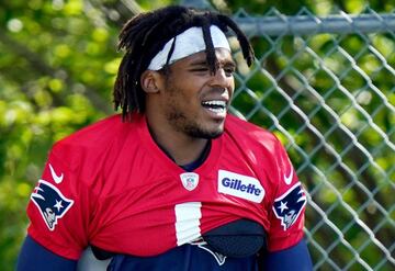 (FILES) In this file photo Cam Newton #1 of the New England Patriots walks to the practice field during training camp at Gillette Stadium on August 23, 2020 in Foxborough, Massachusetts.